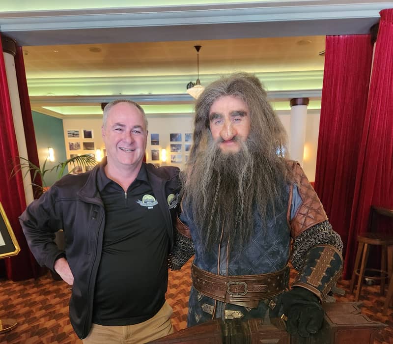 A tour guide standing next to a person in a detailed dwarf movie costume. Credit: Capital Personalised Tours