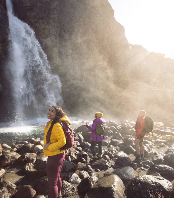 People at Taranaki Falls. Credit: Miles Holden
