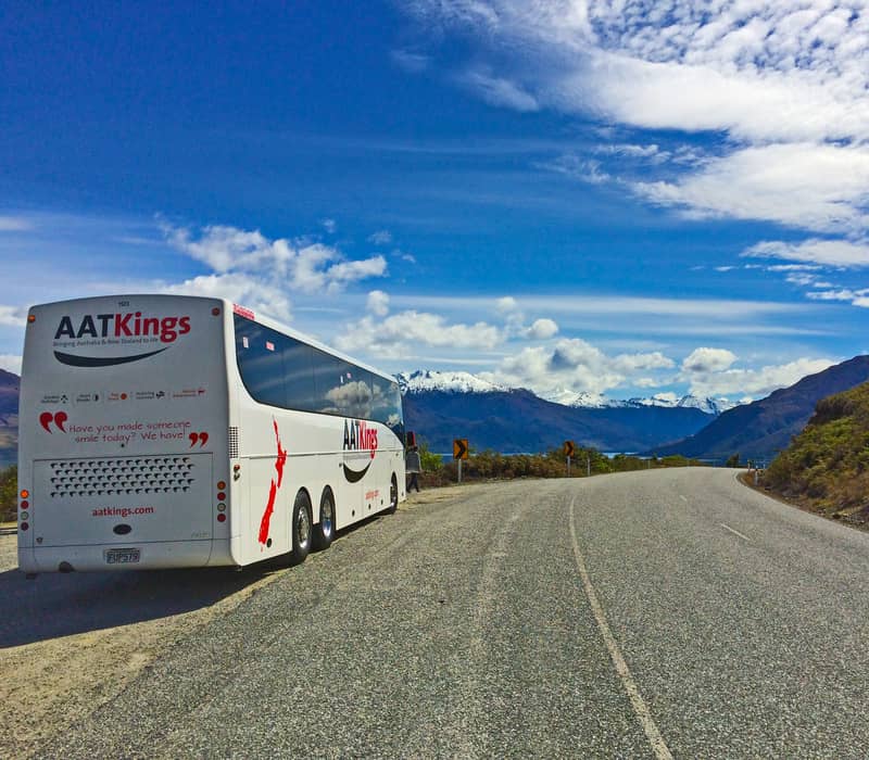 AAT Kings coach on road with mountains in new zealand south island Credit: AAT Kings
