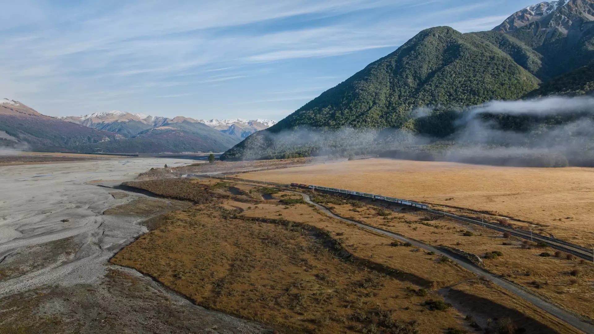 The tranzalpine train travelling through New Zealand's Southern Alps. Photo by Kiwi Rail & Great Journeys New Zealand
