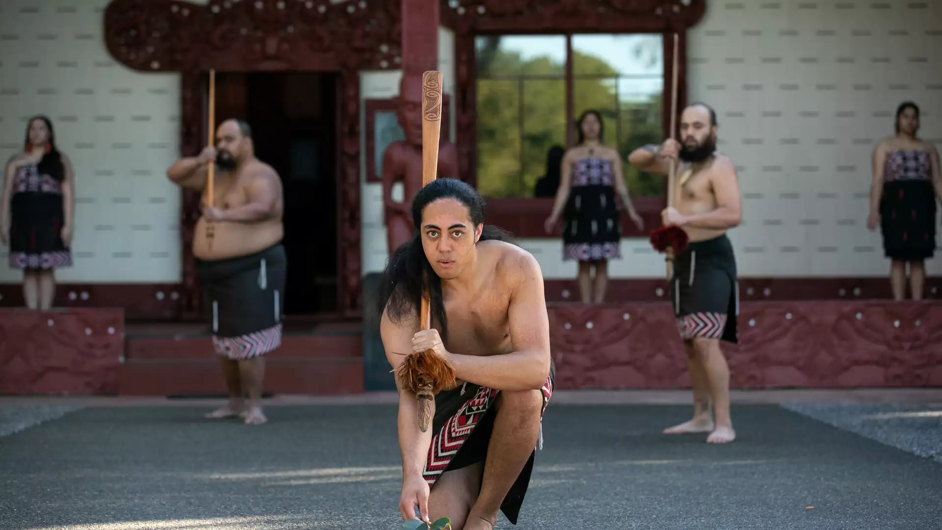 Maori performers in traditional clothing and tattoos dancing at Waitangi Treaty Grounds Credit: Waitangi Treaty Grounds